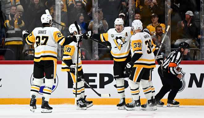 STOCKHOLM, SWEDEN - NOVEMBER 14:  Evgeni Malkin #71 of the Pittsburgh Penguins celebrates his goal with teammates during the second period against the Nashville Predators at Avicii Arena on November 14, 2025 in Stockholm, Sweden. (Photo by Joe Sargent/NHLI via Getty Images)