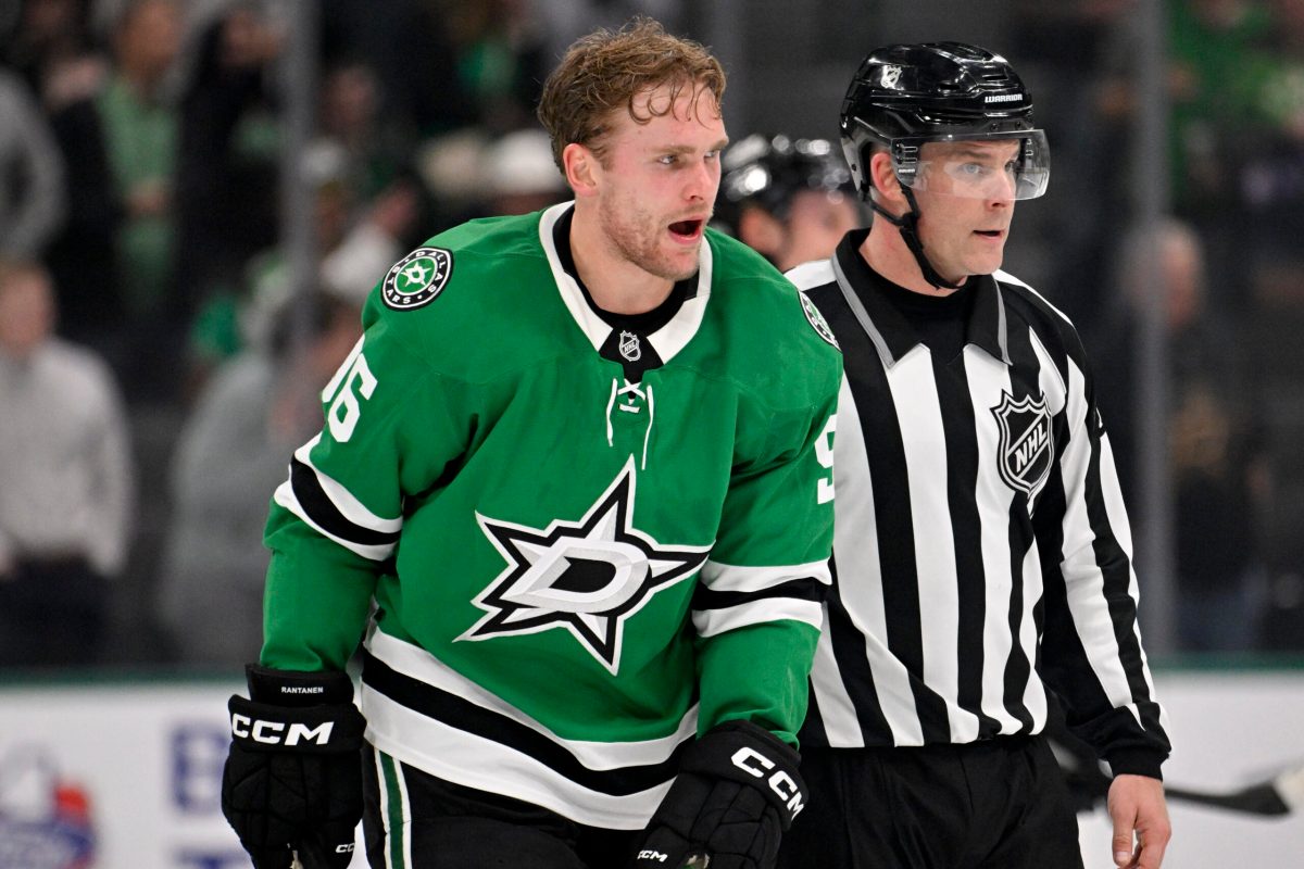 Nov 18, 2025; Dallas, Texas, USA; Dallas Stars right wing Mikko Rantanen (96) is led off the ice after he receives a game misconduct penalty for boarding on New York Islanders defenseman Alexander Romanov (not pictured) during the third period at the American Airlines Center. Mandatory Credit: Jerome Miron-Imagn Images