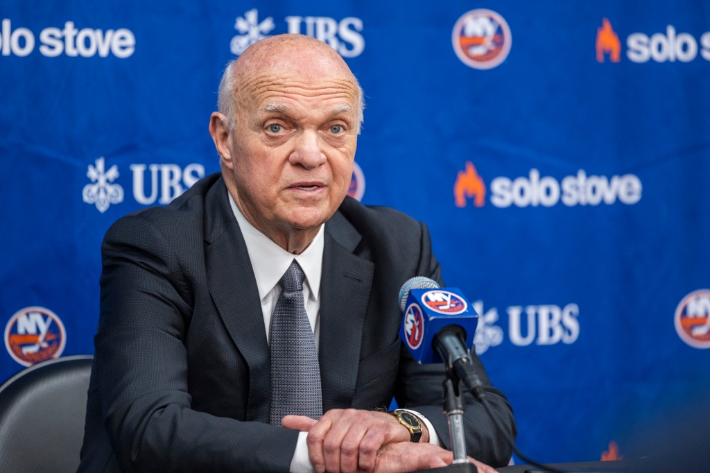 New York Islanders GM Lou Lamoriello speaking at a press conference.