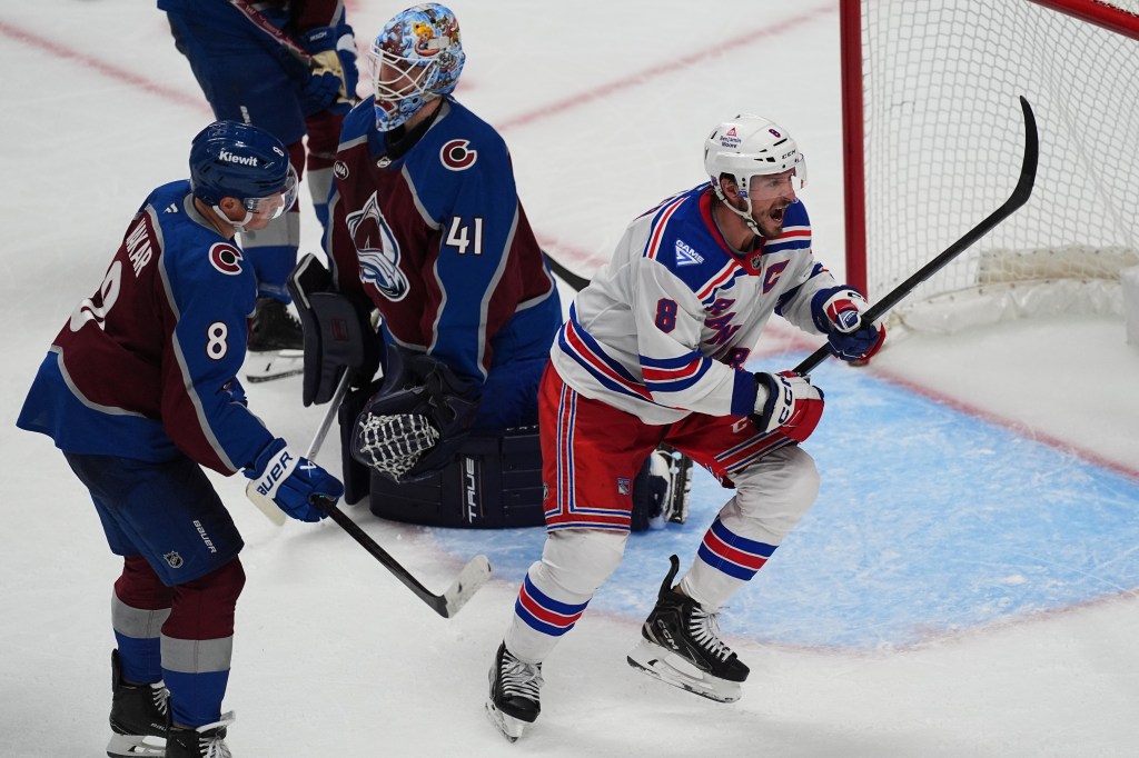 New York Rangers center J.T. Miller reacts after scoring a goal past Colorado Avalanche goaltender Scott Wedgewood as defenseman Cale Makar looks on.
