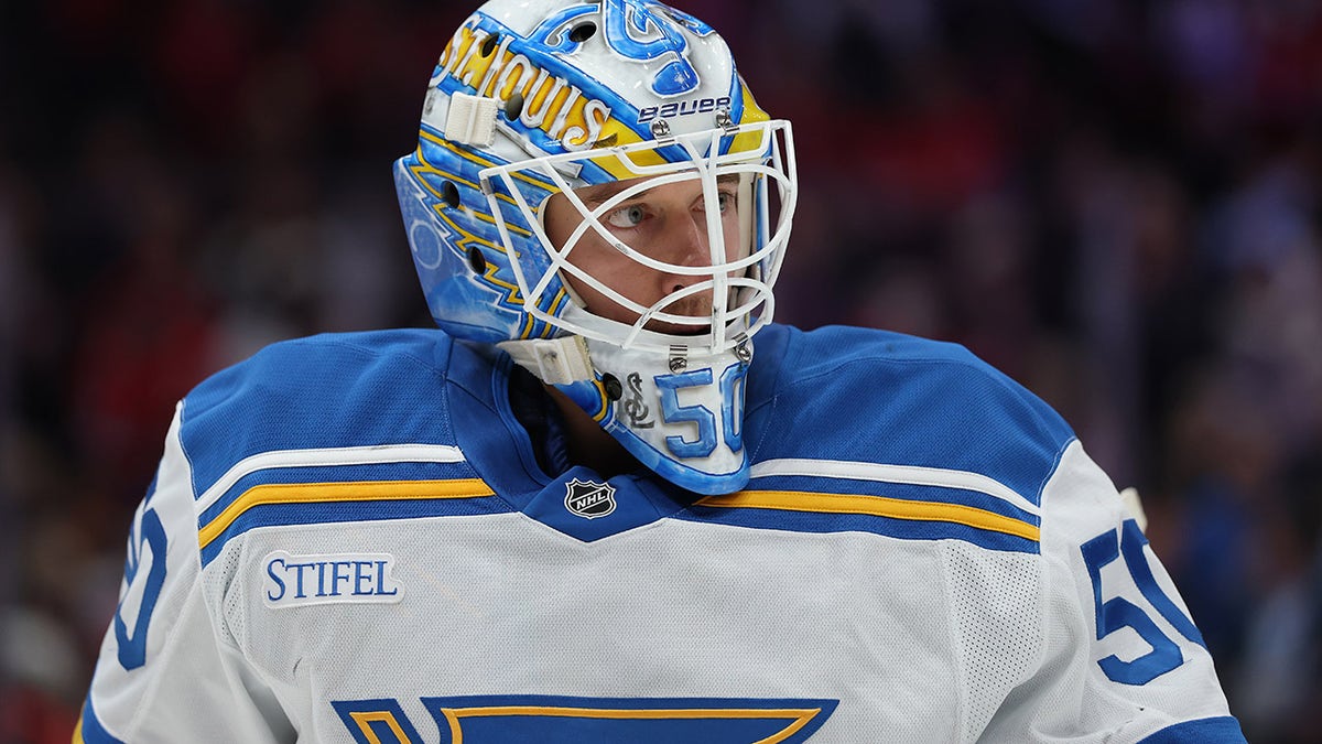Jordan Binnington looks on after allowing Ovechkin's goal