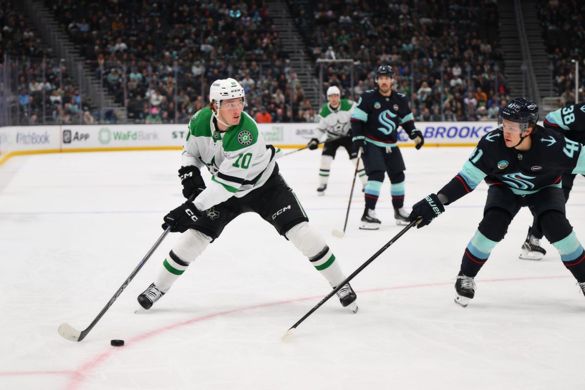 Mar 31, 2025; Seattle, Washington, USA; Dallas Stars center Oskar Back (10) advances the puck against the Seattle Kraken during the first period at Climate Pledge Arena. Mandatory Credit: Steven Bisig-Imagn Images