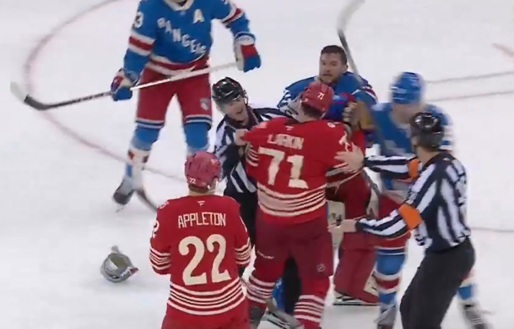 Rangers goalie Jonathan Quick is met by the Red Wings' Dylan Larkin during a postgame fight on Nov. 16, 2025.