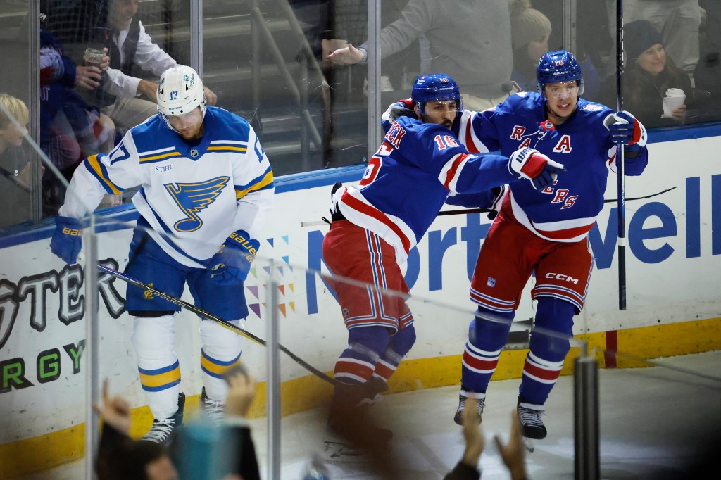 The Rangers celebrate a goal during their Nov. 24 win against the Blues.