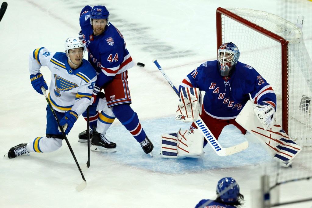 Igor Shesterkin (r.) watches the puck during the Rangers' Nov. 25 win over the Blues.
