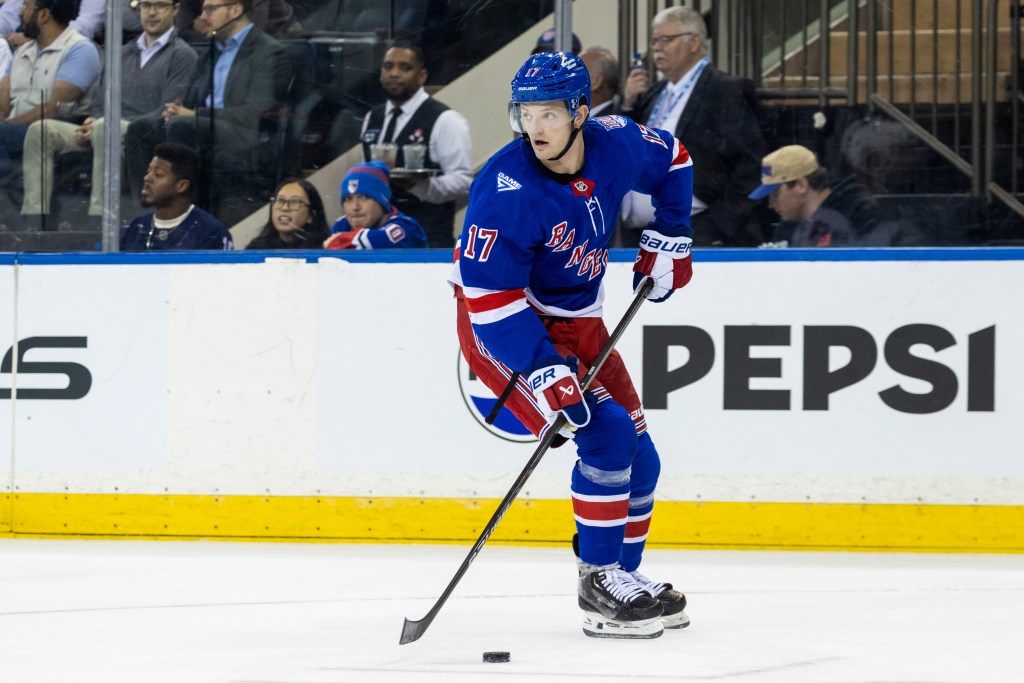New York Rangers defenseman Will Borgen (17) skates with the puck.