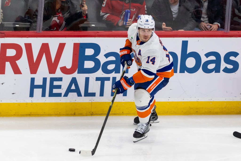 New York Islanders center Bo Horvat (14) skates with the puck during the third period against the New Jersey Devils.