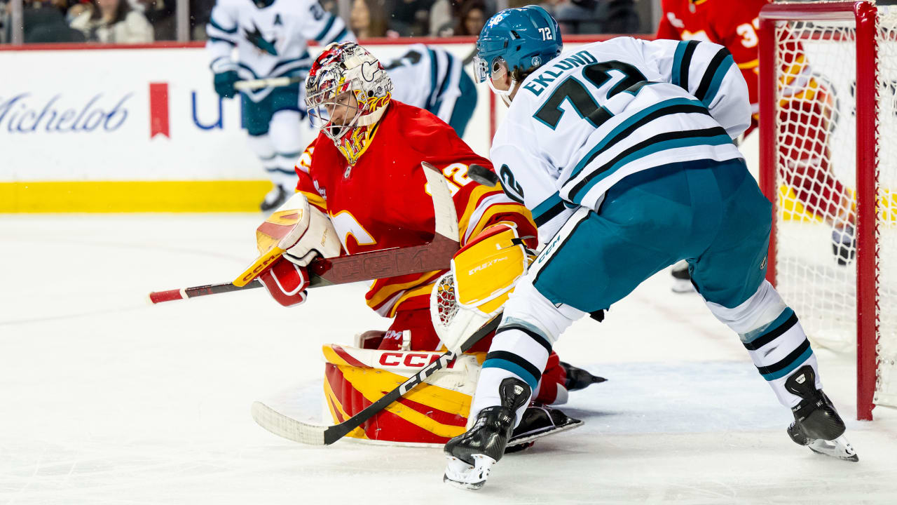 Wolf makes 16 saves, Flames stifle Sharks in shutout
