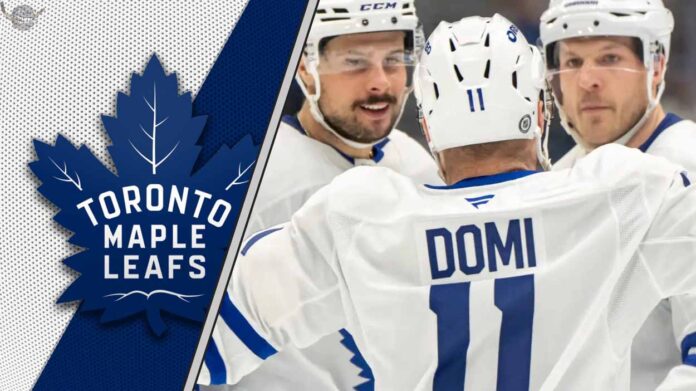 An intense-looking Toronto Maple Leafs player Max Domi skating during an NHL game, representing a potential trade chip.