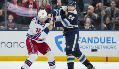 Nov 15, 2025; Columbus, Ohio, USA;  New York Rangers center Sam Carrick (39) fights Columbus Blue Jackets right wing Mathieu Olivier (24) in the second period at Nationwide Arena. Mandatory Credit: Aaron Doster-Imagn Images