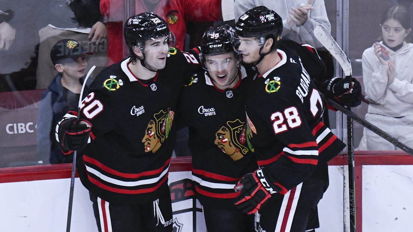 Nov 30, 2025; Chicago, Illinois, USA;  Chicago Blackhawks center Connor Bedard (98) celebrates with  center Ryan Greene (20) and  left wing Andre Burakovsky (28)  after he scores a goal against the Anaheim Ducks during the third period at United Center. Mandatory Credit: Matt Marton-Imagn Images