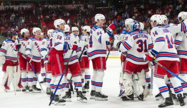 Nov 26, 2025; Raleigh, North Carolina, USA; New York Rangers players celebrate the win against the Carolina Hurricanes at Lenovo Center. Mandatory Credit: James Guillory-Imagn Images