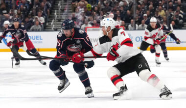 Blue Jackets defenseman Dante Fabbro competes with Devils defenseman Dougie Hamilton.