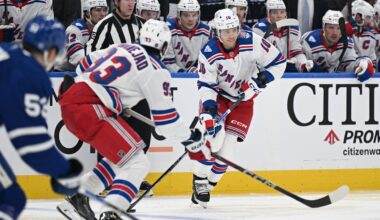 Oct 16, 2025; Toronto, Ontario, CAN; New York Rangers forward Artemi Panarin (10) moves the puck up ice with forward Mika Zibanejad (93) in the third period at Scotiabank Arena. Mandatory Credit: Dan Hamilton-Imagn Images
