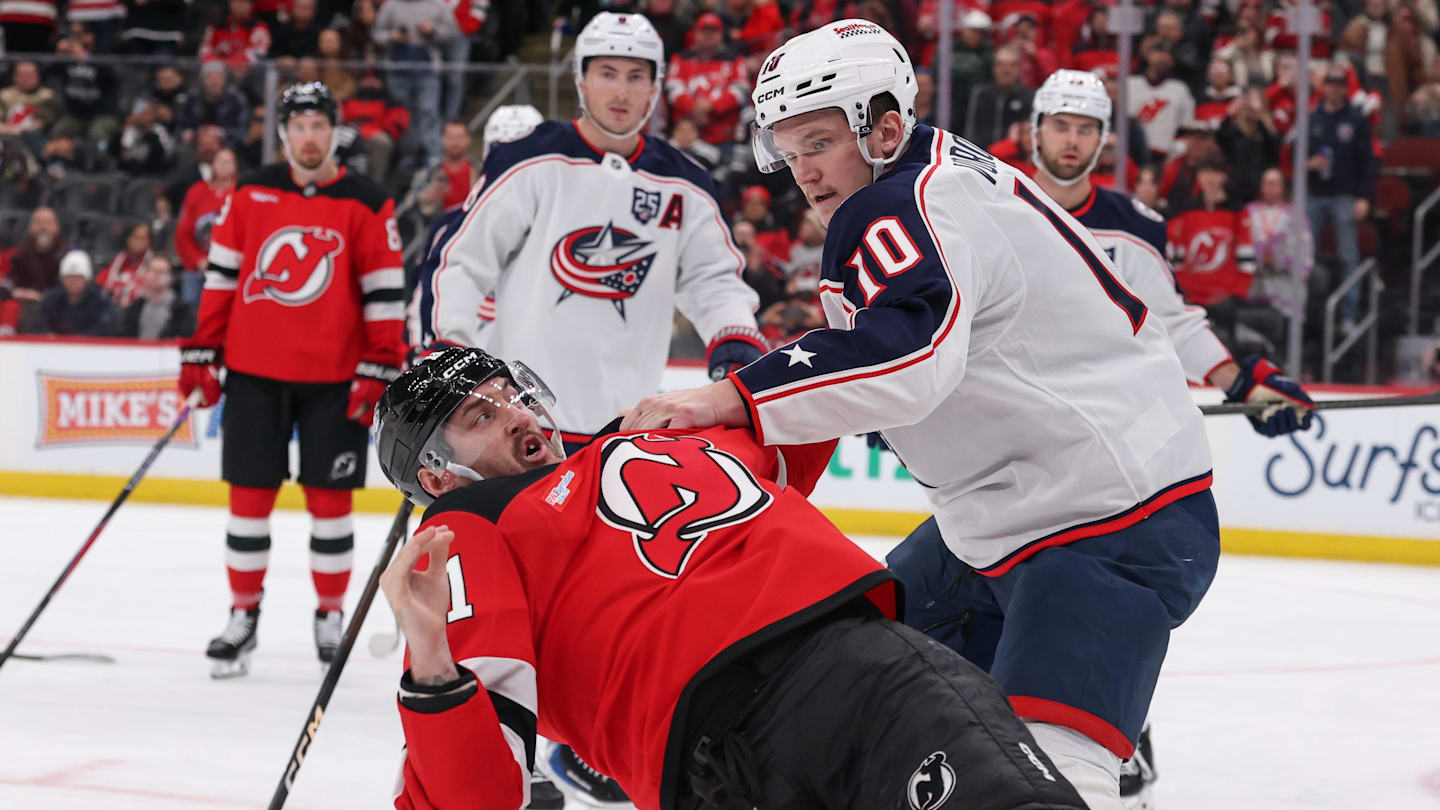 Blue Jackets forward Dmitri Voronkov fights Devils forward Stefan Noesen.