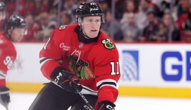 Nov 9, 2025; Detroit, Michigan, USA; Chicago Blackhawks center Oliver Moore (11) takes a shot on Detroit Red Wings goaltender John Gibson (36) (not pictured) during the first period at Little Caesars Arena. Mandatory Credit: Brian Bradshaw Sevald-Imagn Images
