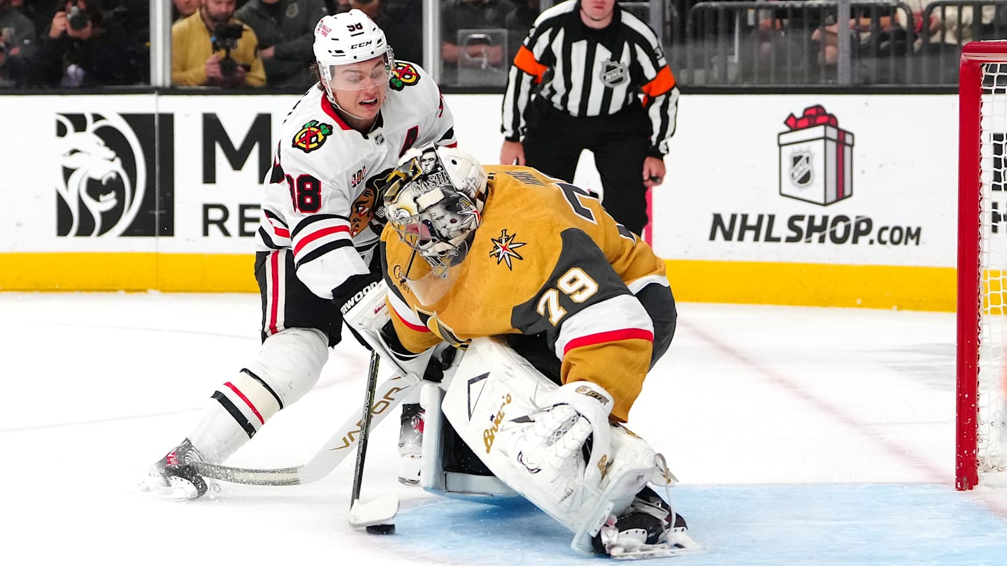 Dec 2, 2025; Las Vegas, Nevada, USA; Chicago Blackhawks center Connor Bedard (98) scores a goal against Vegas Golden Knights goaltender Carter Hart (79) during a shoot out at T-Mobile Arena. Mandatory Credit: Stephen R. Sylvanie-Imagn Images