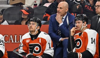 Oct 13, 2025; Philadelphia, Pennsylvania, USA; Philadelphia Flyers head coach Rick Tocchet with right wing Travis Konecny (11) and center Sean Couturier (14) against the Florida Panthers during the first period at Wells Fargo Center.