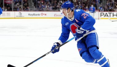 Nov 29, 2025; Denver, Colorado, USA; Colorado Avalanche center Nathan MacKinnon (29) controls the puck in the second period against the Montreal Canadiens at Ball Arena. Mandatory Credit: Ron Chenoy-Imagn Images