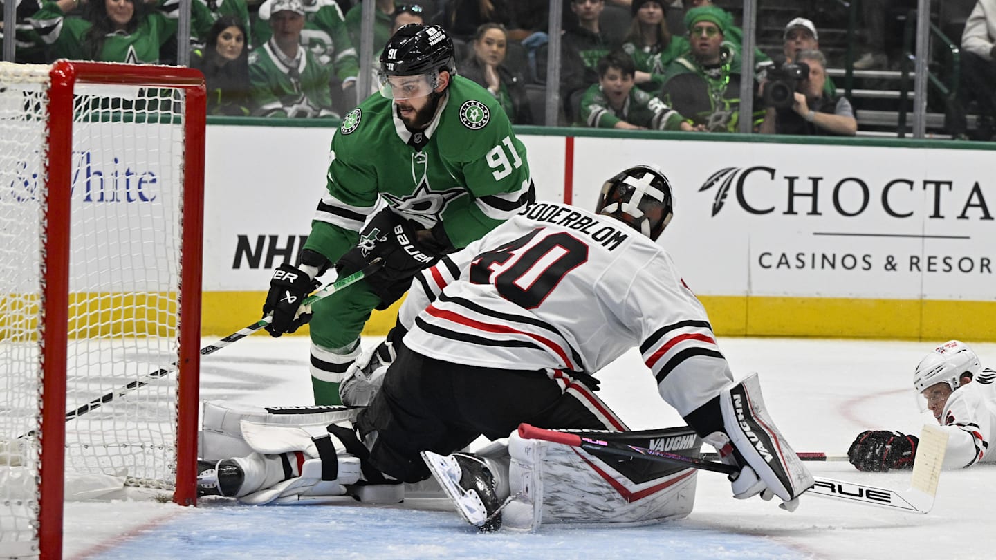 Nov 7, 2024; Dallas, Texas, USA; Chicago Blackhawks goaltender Arvid Soderblom (40) stops a short by Dallas Stars center Tyler Seguin (91) during the second period at the American Airlines Center. Mandatory Credit: Jerome Miron-Imagn Images