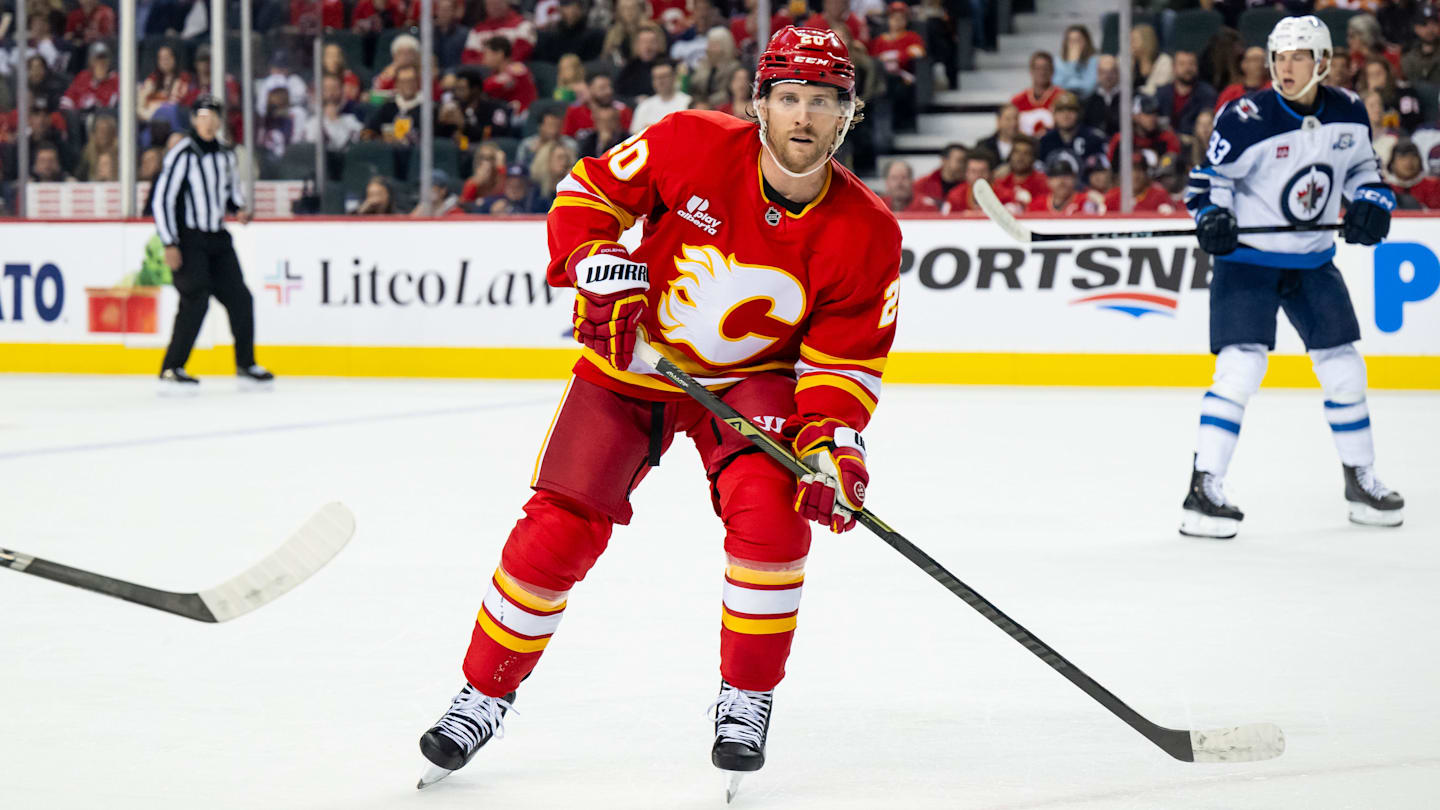 Oct 20, 2025; Calgary, Alberta, CAN; Calgary Flames left wing Blake Coleman (20) in action against the Winnipeg Jets during the first period at Scotiabank Saddledome. Mandatory Credit: Brett Holmes-Imagn Images