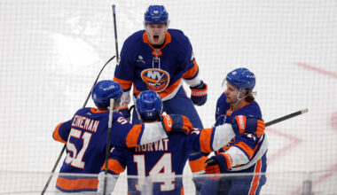 Dec 4, 2025; Elmont, New York, USA; New York Islanders center Bo Horvat (14) celebrates his goal against the Colorado Avalanche with left wing Emil Heineman (51) and defenseman Matthew Schaefer (48) and right wing Max Shabanov (49) during the second period at UBS Arena. Mandatory Credit: Brad Penner-Imagn Images