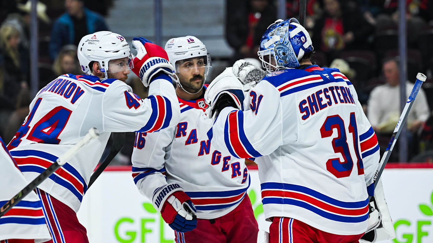 Dec 4, 2025; Ottawa, Ontario, CAN; New York Rangers players gather around goalie Igor Shesterkin (31) to celebrate their win against the Ottawa Senators at Canadian Tire Centre. Mandatory Credit: David Kirouac-Imagn Images
