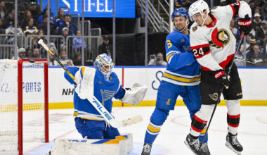 Nov 28, 2025; St. Louis, Missouri, USA; St. Louis Blues goaltender Jordan Binnington (50) and defenseman Philip Broberg (6) defend the net against Ottawa Senators center Dylan Cozens (24) during the third period at Enterprise Center. Mandatory Credit: Jeff Curry-Imagn Images