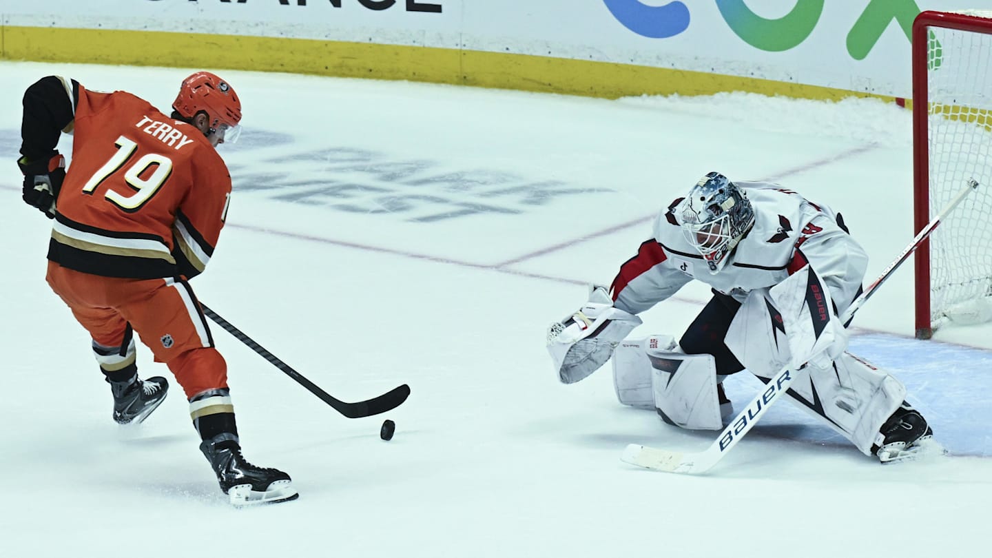 Dec 5, 2025; Anaheim, California, USA; Anaheim Ducks right wing Troy Terry (19) skates with the puck against Washington Capitals goaltender Logan Thompson (48) during the penalty shootout at Honda Center. Mandatory Credit: Griffin Hooper-Imagn Images