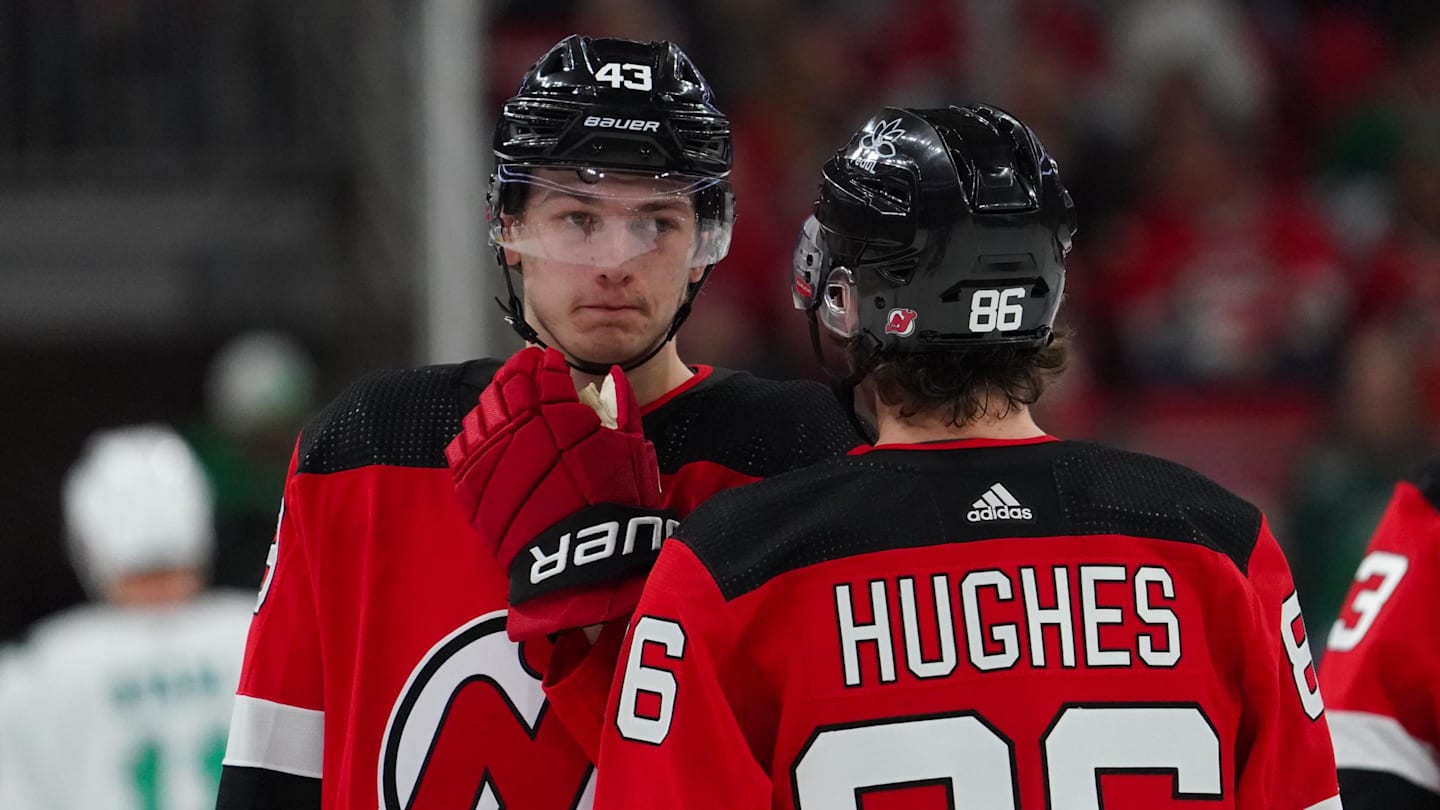 Feb 10, 2024; Raleigh, North Carolina, USA; New Jersey Devils center Jack Hughes (86) and defenseman Luke Hughes (43) talk against the Carolina Hurricanes during the first period at PNC Arena. Mandatory Credit: James Guillory-Imagn Images