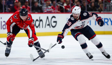 Blue Jackets forward Adam Fantilli competes with Washington defenseman John Carlson.