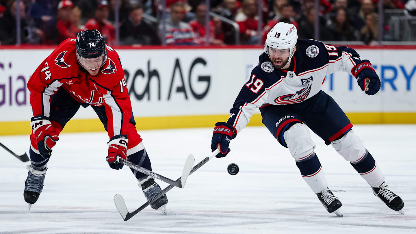 Blue Jackets forward Adam Fantilli competes with Washington defenseman John Carlson.