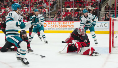 Dec 7, 2025; Raleigh, North Carolina, USA;  San Jose Sharks center Alexander Wennberg (21) scores a goal past Carolina Hurricanes goaltender Pyotr Kochetkov (52) during the second period at Lenovo Center. Mandatory Credit: James Guillory-Imagn Images