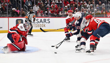 Blue Jackets forward Isac Lundestrom attempts to score against Capitals goalie Logan Thompson.