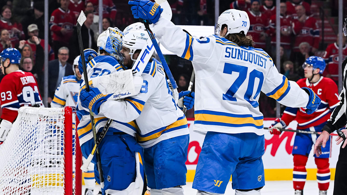 Dec 7, 2025; Montreal, Quebec, CAN; St. Louis Blues players jump on goalie Jordan Binnington (50) to celebrate the win against the Montreal Canadiens at Bell Centre. Mandatory Credit: David Kirouac-Imagn Images