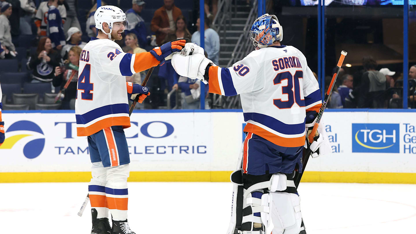 Dec 6, 2025; Tampa, Florida, USA;New York Islanders defenseman Scott Mayfield (24) and goaltender Ilya Sorokin (30) celebrate after they beat the Tampa Bay Lightning at Benchmark International Arena. Mandatory Credit: Kim Klement Neitzel-Imagn Images