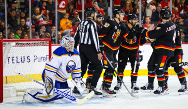 Dec 8, 2025; Calgary, Alberta, CAN; Calgary Flames left wing Jonathan Huberdeau (10) scores a goal against Buffalo Sabres goaltender Ukko-Pekka Luukkonen (1) during the second period at Scotiabank Saddledome. Mandatory Credit: Sergei Belski-Imagn Images
