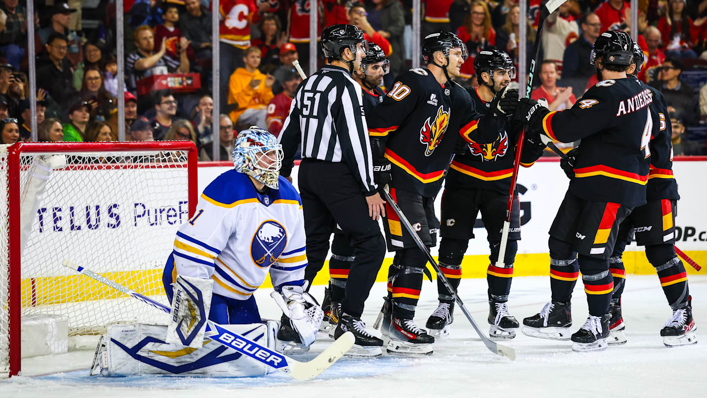 Dec 8, 2025; Calgary, Alberta, CAN; Calgary Flames left wing Jonathan Huberdeau (10) scores a goal against Buffalo Sabres goaltender Ukko-Pekka Luukkonen (1) during the second period at Scotiabank Saddledome. Mandatory Credit: Sergei Belski-Imagn Images