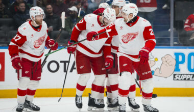 Dec 8, 2025; Vancouver, British Columbia, CAN; Detroit Red Wings defenseman Ben Chiarot (8) and forward Michael Rasmussen (27) and forward J.T. Compher (37) and forward James van Riemsdyk (21) celebrate Riemsdyk’s goal against the Vancouver Canucks in the first period at Rogers Arena. Mandatory Credit: Bob Frid-Imagn Images