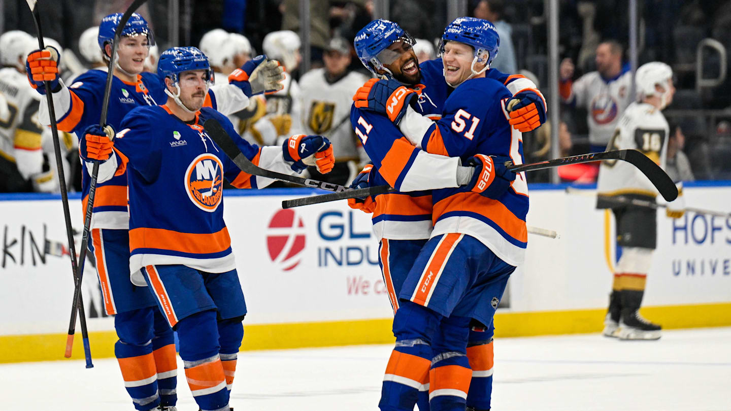 Dec 9, 2025; Elmont, New York, USA; New York Islanders left wing Emil Heineman (51) celebrates his winning goal with New York Islanders left wing Anthony Duclair (11) after shootouts against the Vegas Golden Knights at UBS Arena. Mandatory Credit: Dennis Schneidler-Imagn Images