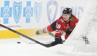 Dec 10, 2025; Chicago, Illinois, USA; Chicago Blackhawks center Connor Bedard (98) dives for the puck against the New York Rangers during the first period at United Center. Mandatory Credit: David Banks-Imagn Images