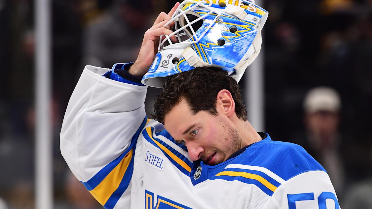 Dec 4, 2025; Boston, Massachusetts, USA; St. Louis Blues goaltender Jordan Binnington (50) slips on his goalie mask during the third period against the Boston Bruins at TD Garden. Mandatory Credit: Bob DeChiara-Imagn Images