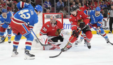 Dec 10, 2025; Chicago, Illinois, USA; New York Rangers center Noah Laba (42) shoots the puck on Chicago Blackhawks goaltender Spencer Knight (30) during the third period at United Center. Mandatory Credit: David Banks-Imagn Images