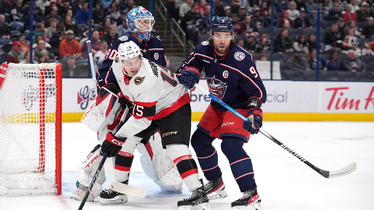 Blue Jackets defenseman Ivan Provorov clashes with Ottawa forward Matthew Highmore in front of Elvis Merzlikins.