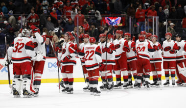Dec 11, 2025; Washington, District of Columbia, USA; Carolina Hurricanes goaltender Brandon Bussi (32) celebrates with teammates after their game against the Washington Capitals at Capital One Arena. Mandatory Credit: Geoff Burke-Imagn Images