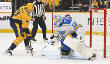 Dec 11, 2025; Nashville, Tennessee, USA;  St. Louis Blues goaltender Jordan Binnington (50) blocks the shot of Nashville Predators center Steven Stamkos (91) during the first period at Bridgestone Arena. Mandatory Credit: Steve Roberts-Imagn Images