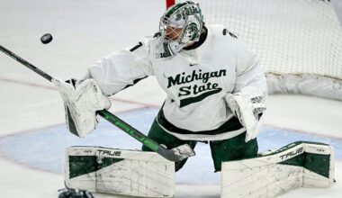 Michigan State's Trey Augustine deflects a Minnesota shot during overtime on Saturday, Jan. 25, 2025, at Munn Arena in East Lansing.
