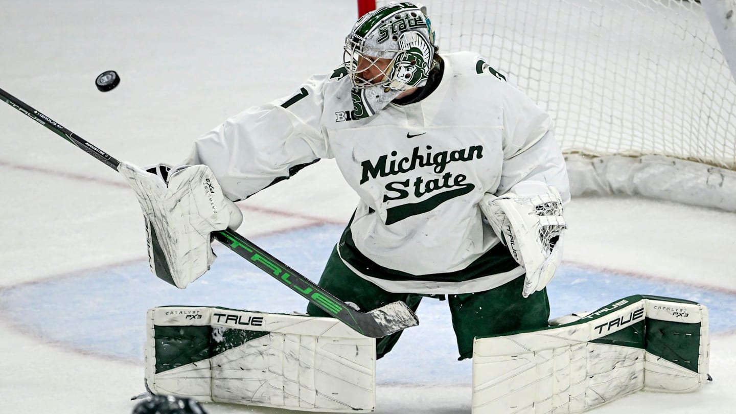 Michigan State's Trey Augustine deflects a Minnesota shot during overtime on Saturday, Jan. 25, 2025, at Munn Arena in East Lansing.