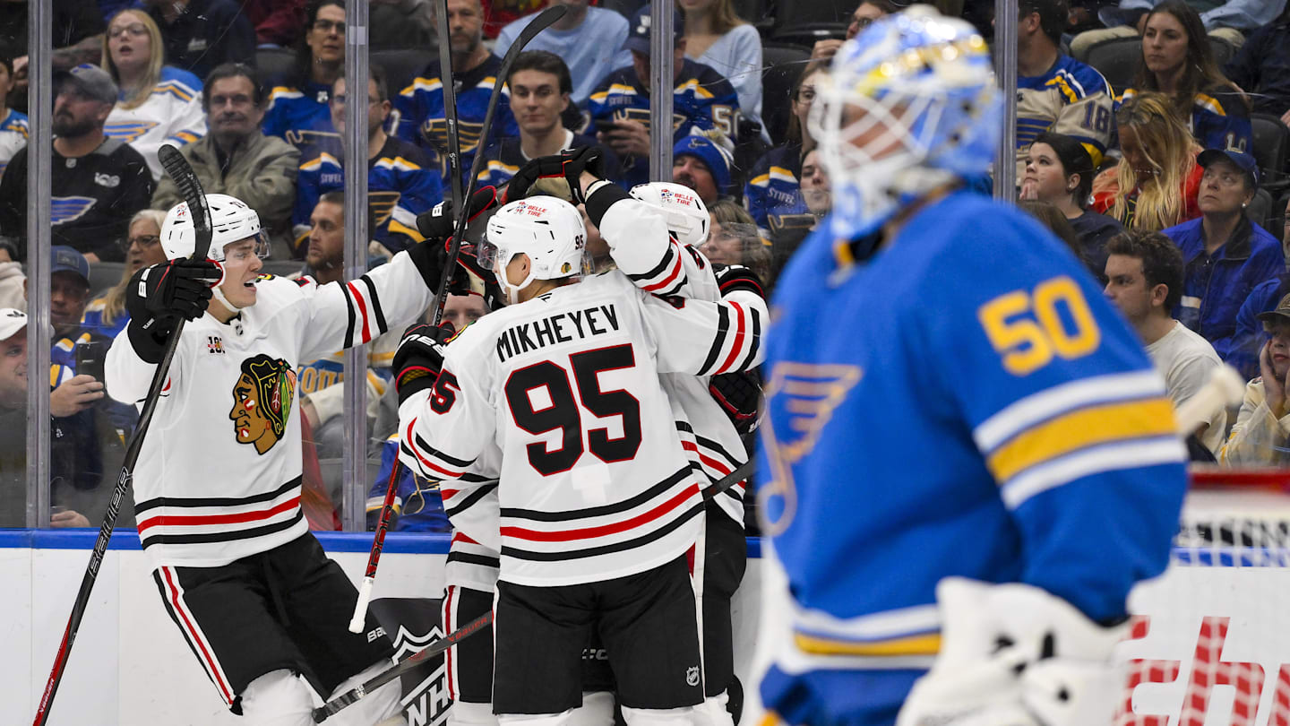Oct 15, 2025; St. Louis, Missouri, USA; Chicago Blackhawks center Jason Dickinson (16) is congratulated by teammates after scoring against St. Louis Blues goaltender Jordan Binnington (50) during the second period at Enterprise Center. Mandatory Credit: Jeff Curry-Imagn Images