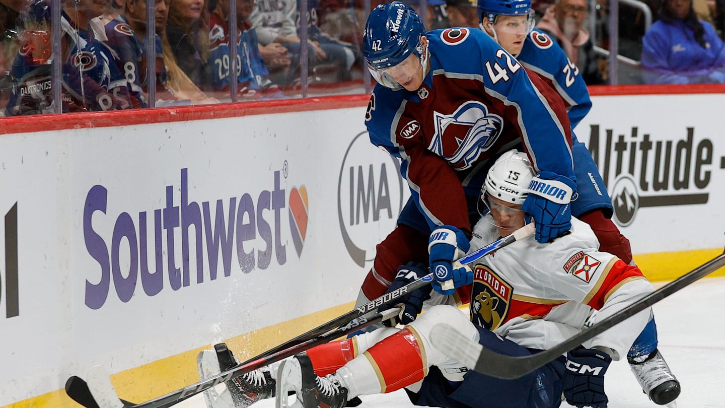 Dec 11, 2025; Denver, Colorado, USA; Florida Panthers center Anton Lundell (15) and Colorado Avalanche defenseman Josh Manson (42) battle for the puck in the first period at Ball Arena. Mandatory Credit: Isaiah J. Downing-Imagn Images